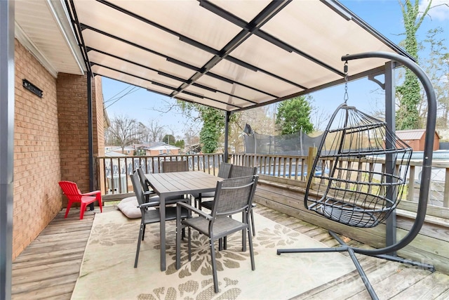 view of patio / terrace featuring a trampoline and outdoor dining area