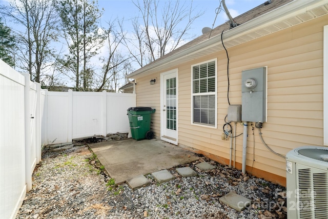 view of patio featuring central air condition unit and a fenced backyard