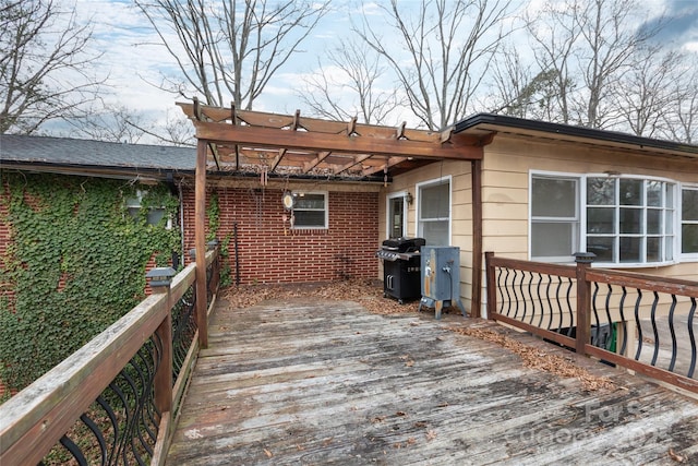 deck featuring a pergola and area for grilling