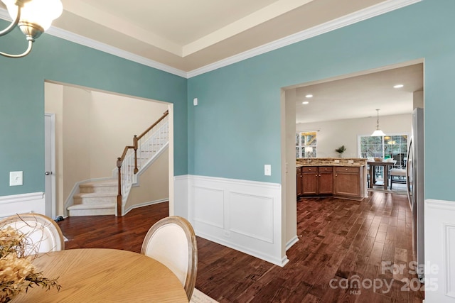 dining area featuring dark hardwood / wood-style flooring and a notable chandelier