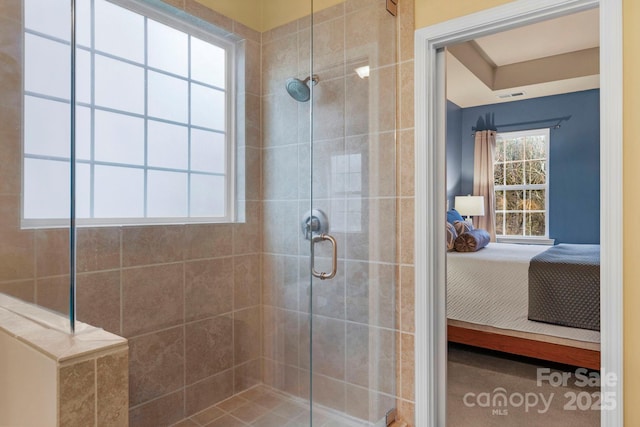 bathroom with a shower with door