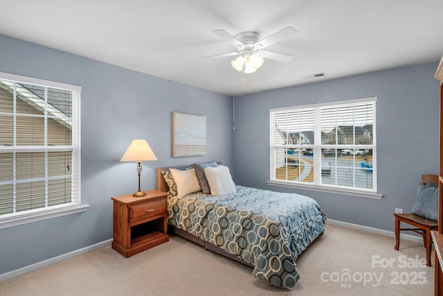 carpeted bedroom with ceiling fan