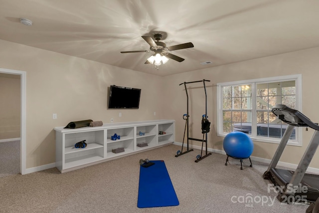 workout room with ceiling fan and carpet