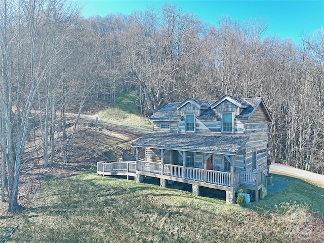 view of front of house featuring a front yard and a wooden deck