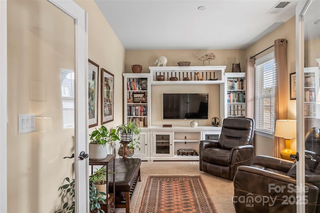 sitting room featuring carpet