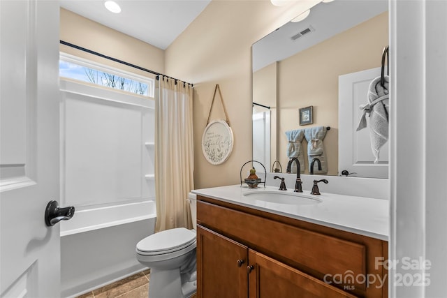 full bathroom featuring shower / bath combination with curtain, vanity, and toilet