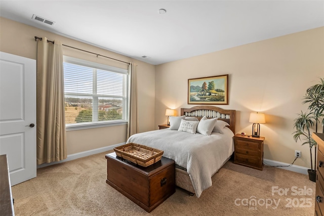 bedroom with light carpet