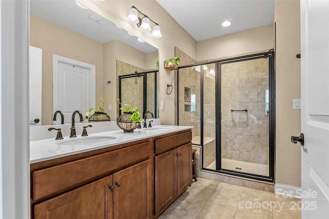 bathroom with vanity, tile patterned floors, and a shower with shower door