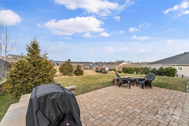 view of patio featuring grilling area and an outdoor fire pit