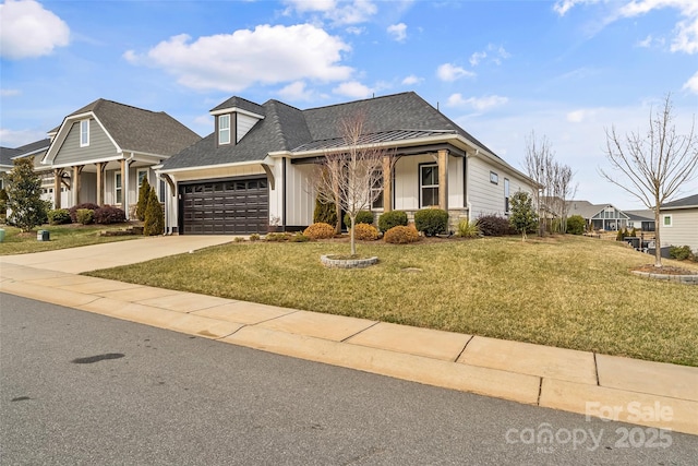 view of front of house featuring a garage and a front yard