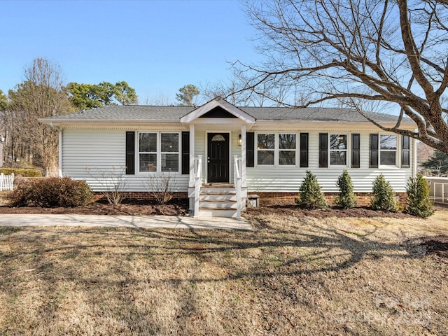 ranch-style home with a front lawn