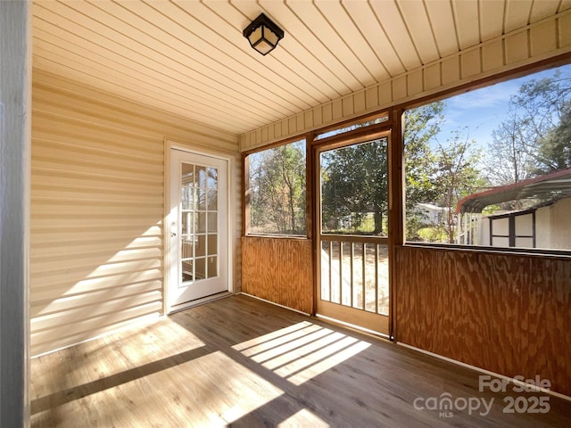 unfurnished sunroom with wooden ceiling