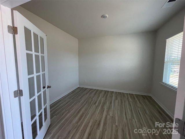 unfurnished room featuring dark hardwood / wood-style floors