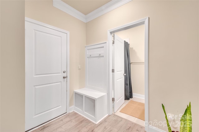 mudroom with crown molding and light hardwood / wood-style flooring