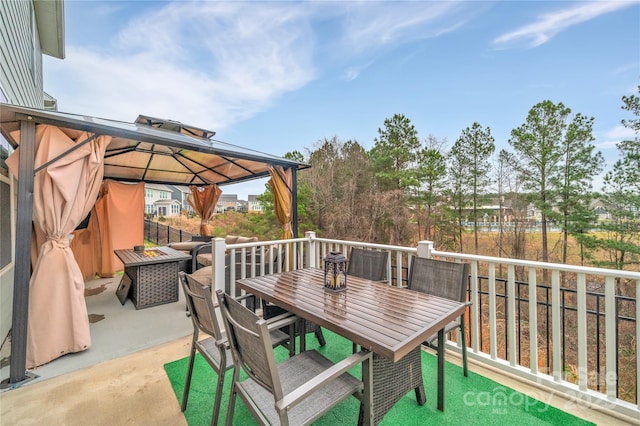 view of patio with a gazebo and an outdoor fire pit