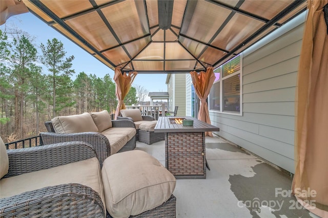 view of patio featuring a gazebo and outdoor lounge area