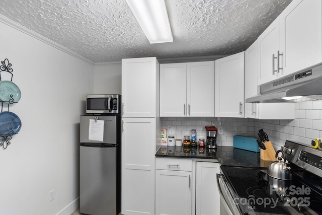 kitchen with tasteful backsplash, a textured ceiling, stainless steel appliances, and white cabinets