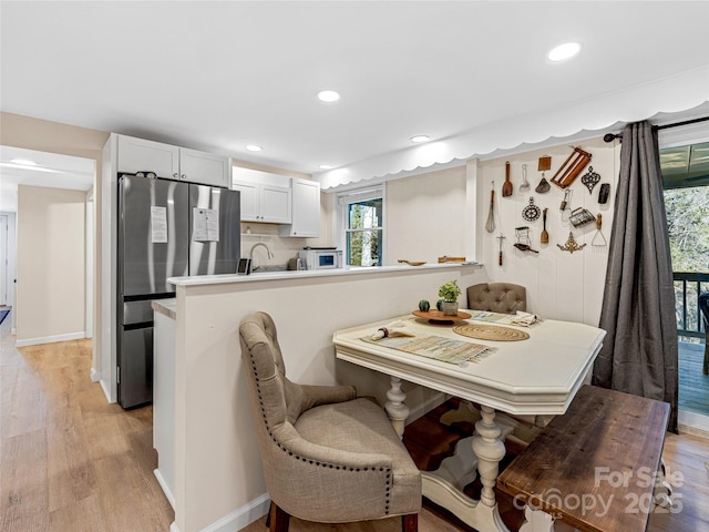 dining room featuring light hardwood / wood-style floors