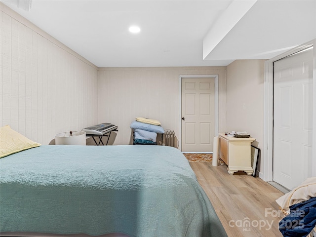 bedroom with light hardwood / wood-style floors