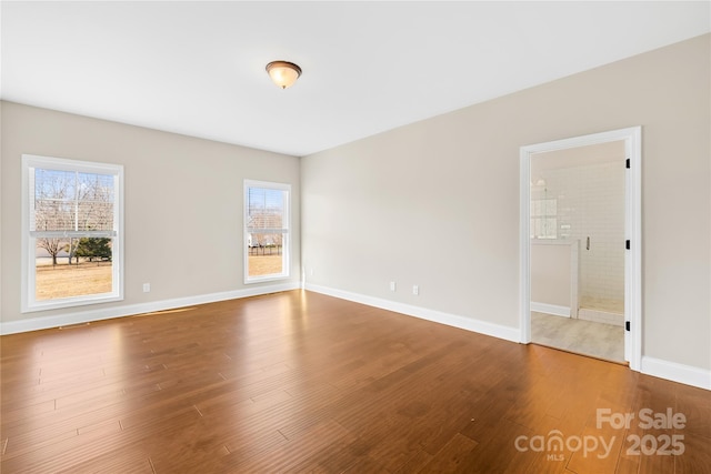 unfurnished room featuring wood-type flooring