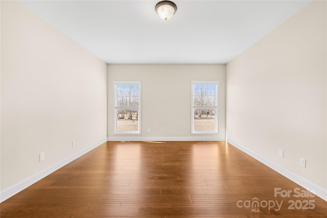 spare room featuring hardwood / wood-style flooring