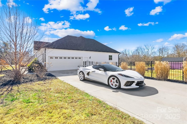 view of side of home featuring a garage