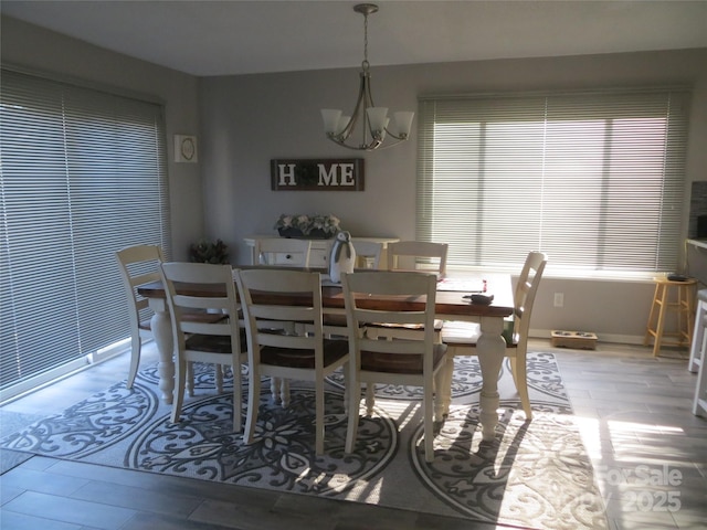 dining room featuring a notable chandelier