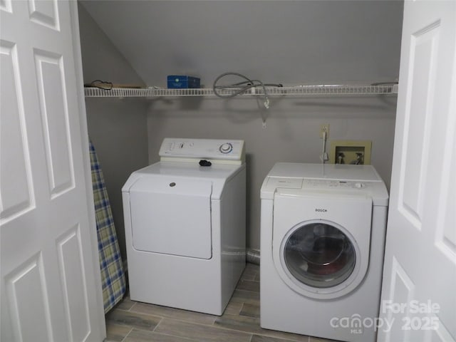 laundry room with independent washer and dryer