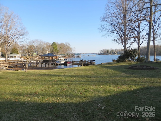 exterior space featuring a water view and a dock