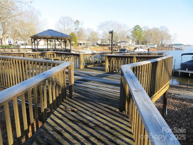 dock area with a water view and a gazebo