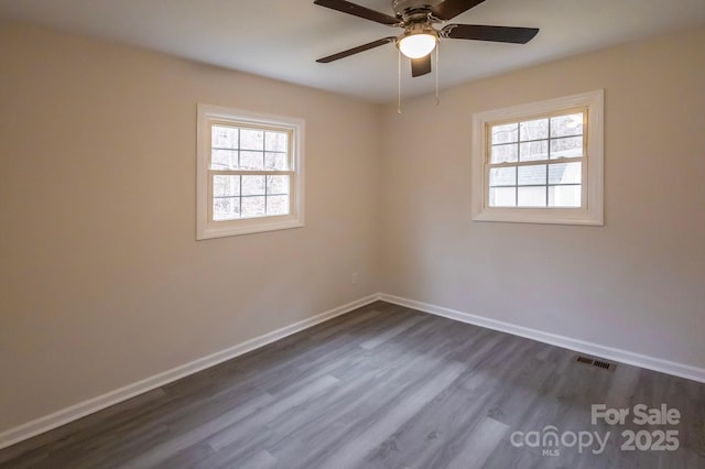 unfurnished room featuring dark hardwood / wood-style flooring