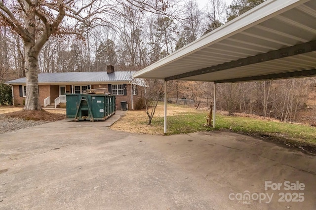 exterior space with a carport