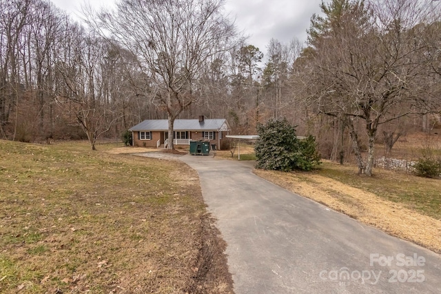 view of front of house with a porch and a front yard