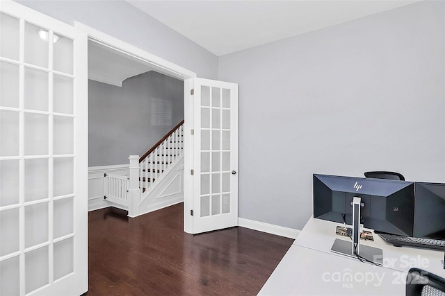 home office with dark hardwood / wood-style flooring