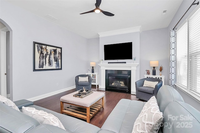 living room with ceiling fan and dark hardwood / wood-style floors