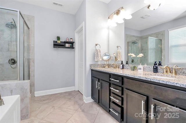 bathroom with vanity and a shower with door