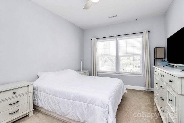 bedroom with light carpet and ceiling fan