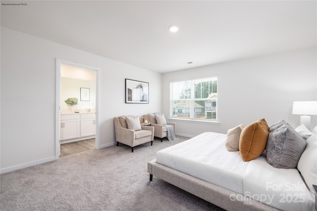 carpeted bedroom with connected bathroom