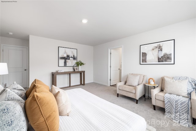 bedroom featuring light carpet