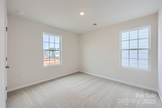 unfurnished room featuring carpet flooring