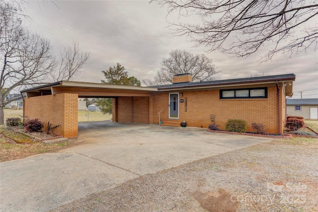 ranch-style home with a carport