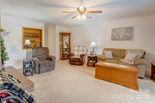 living room with carpet, a ceiling fan, and crown molding