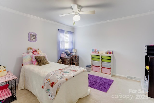 bedroom with baseboards, ceiling fan, carpet flooring, and crown molding