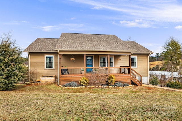 view of front facade with a front yard and a porch