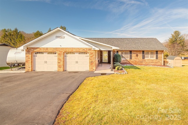 ranch-style house featuring a garage and a front yard