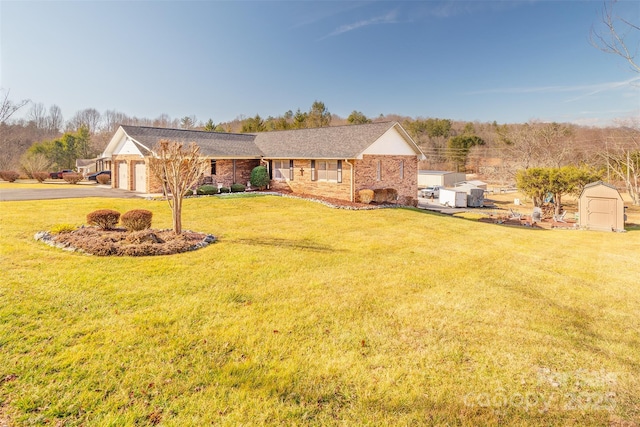 ranch-style house featuring a garage and a front lawn