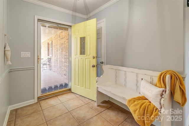 interior space featuring crown molding and light tile patterned floors