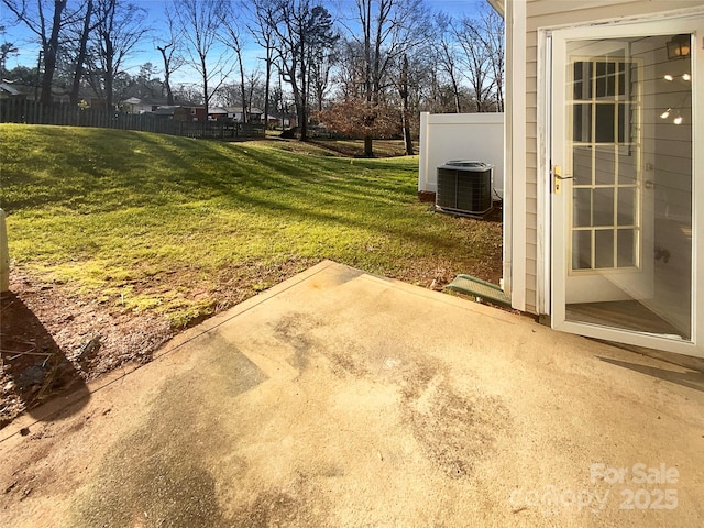 view of yard with central AC unit and a patio area