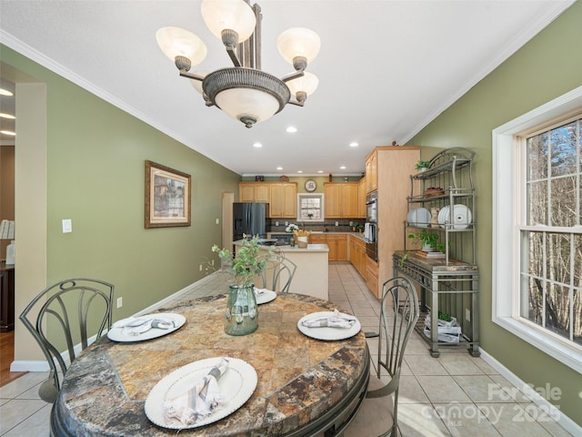 tiled dining room with crown molding and a chandelier