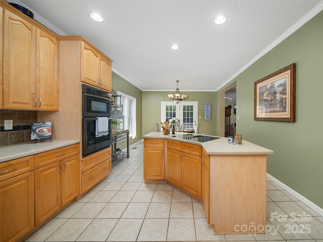 kitchen featuring crown molding, decorative light fixtures, light tile patterned floors, a kitchen island, and black appliances